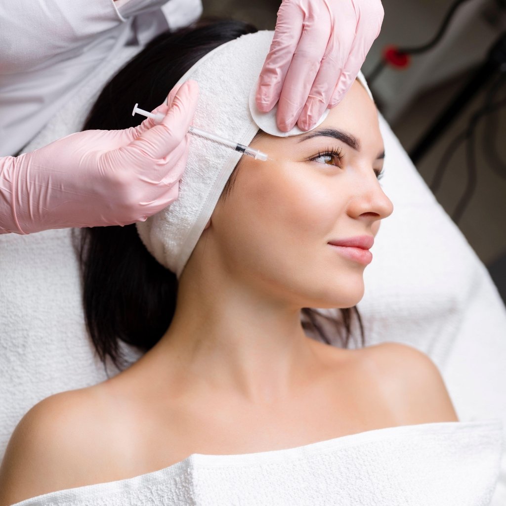 Dermatologist performing an aesthetic dermatology facial procedure during hands-on clinical fellowship training at DermaMD Clinics under Dr. Tanvi Vaidya.